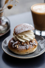 Semla - traditional Swedish cream and almonnd paste filled cardamom bun for shrove Tuesday