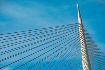 suspension wires reaching high into the sky, the metal bridge in Belgrade, Serbia, stands tall as a...