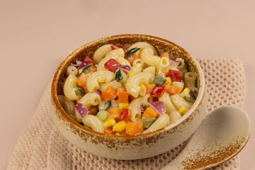 Macaroni Salad with Bell Pepper, Onion, Corn and Mayonnaise Dressing.