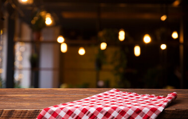 empty table to showcase your product, against the background of a blurred cafe golden bokeh. High quality photo