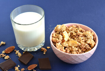 bowl of banana granola with glass of milk 