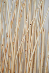 Texture. Peeled sticks made of light wood. Wall - 723702354