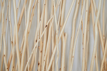 Texture. Peeled sticks made of light wood. Wall - 723702530