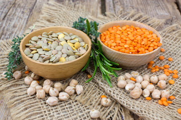 lentils and fresh herbs - wooden background