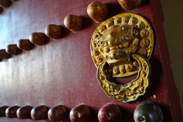 Door handles in the shape of an animal's head. Tiantan Sky Temple.