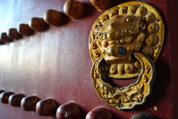 Door handles in the shape of an animal's head. Tiantan Sky Temple.