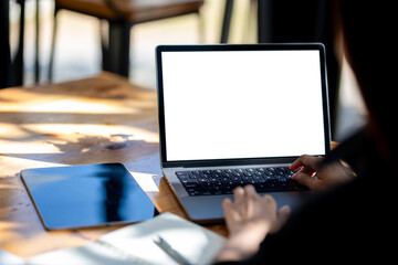 Fototapeta na wymiar Business woman using laptop. A white-screen laptop mockup.