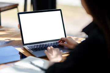 Business woman using laptop. A white-screen laptop mockup.