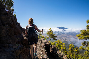 Obraz premium Young woman summit to Bejenado Peak in Caldera de Taburiente, La Palma, Spain