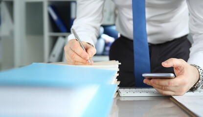 Businessman signs stack documents in table office. Man created workplace at home during quarantine....