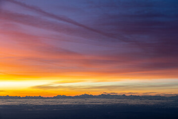 Naklejka na ściany i meble Colourful morning sky with Cirrus clouds above Swiss Alps