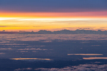 Fototapeta na wymiar Colourful morning sky with Cirrus clouds above Swiss Alps