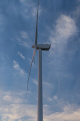 Fototapeta na wymiar 日本　静岡県磐田市の竜洋海洋公園近くに建つ風力発電の風車と夕焼け空