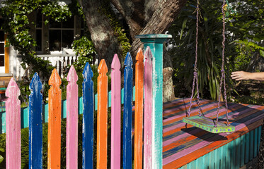 Colorful gate at Richmond road. Garde. Tree and swing. Auckland New Zealand.