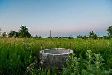 concrete ring in the field in the evening