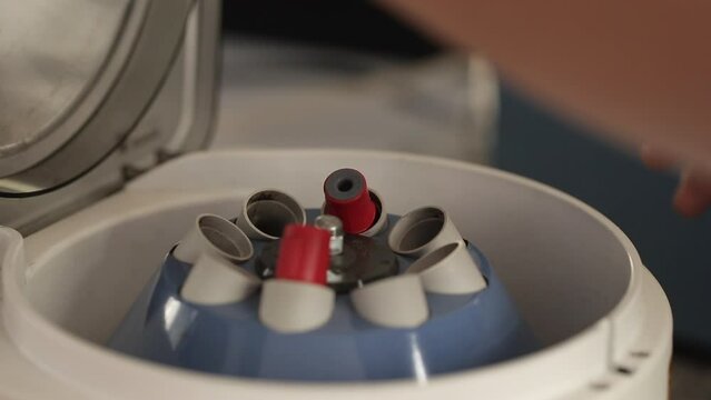 Close-up shot of blood samples spinning in centrifuge during fractionation process