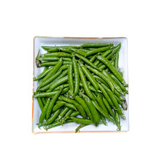 Top view of Young Peas in the Dish. Healthy and green food. Fresh green peas. Pods of green organic peas in a White Dish.