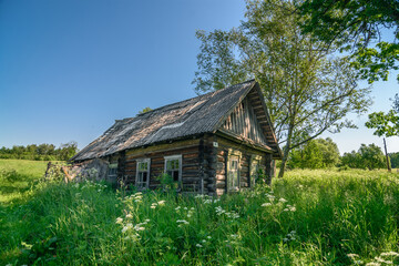 Fototapeta na wymiar Ruined house in abandoned Russian village