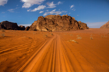 Wadi Rum Desert in Jordan. On the Sunset. Panorama of beautiful sand pattern on the dune. Desert landscape in Jordan. Travel concept. Freedom