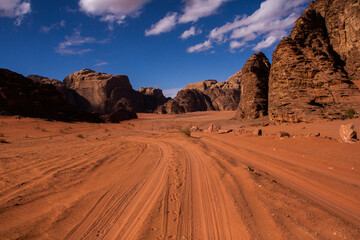 Wadi Rum Desert in Jordan. On the Sunset. Panorama of beautiful sand pattern on the dune. Desert landscape in Jordan. Travel concept. Freedom