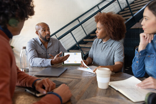 African American businessman giving a presentation in a business meeting - Powered by Adobe