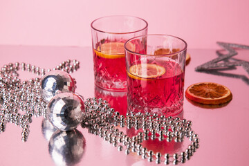 christmas still life with red cocktails and decorations