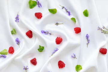 Obraz na płótnie Canvas raspberries with lavender and mint