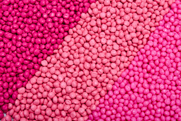 masterbatch granules in three kinds of pink colors, this polymer is a colorant for products in the...