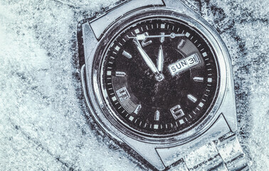 Fototapeta na wymiar Dead watch. Time is limited. The wristwatch is frozen. Concept of the end.