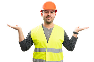 Friendly builder man holding palms presenting copyspace for text