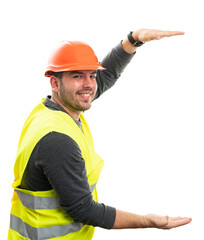 Happy builder man presenting object copyspace between hands