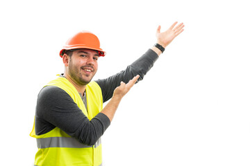 Cheerful builder man presenting blank copyspace with palms