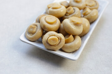 Champignon mushrooms in brine. Canned champignon mushrooms whole