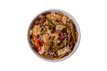 Delicious Asian dish udon with hot peppers, green beans, spices and herbs