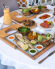 Colorful Spanish food assortment, with fish, paella and vegetables 
