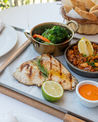 Colorful Spanish food assortment, with fish, paella and vegetables 