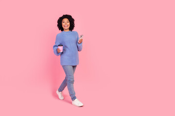 Full length photo of cute sweet woman wear pullover enjoying coffee to go communicating device...