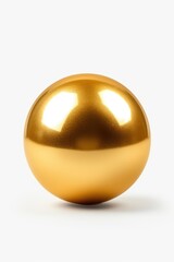 A shiny golden ball placed on a white surface. Suitable for various uses