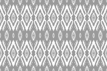 Fabric ethnic ikat art. Seamless pattern in tribal. Aztec geometric ornament print. Design for background, wallpaper, illustration, fabric, clothing, carpet, textile, batik, embroidery.