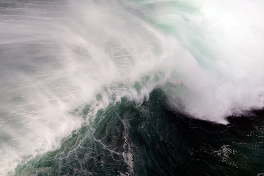 Surf wave close-op top view in Playa del Norte, Nazare