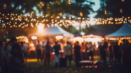 Blur image of people at a festival in the evening. bokeh