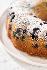 Lemon blueberry bundt cake with powdered sugar dusting