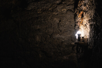 Lamp on the wall of an ancient castle dungeon