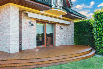 Luxury villa exterior with garden terrace and wooden exotic floor. - 723812920