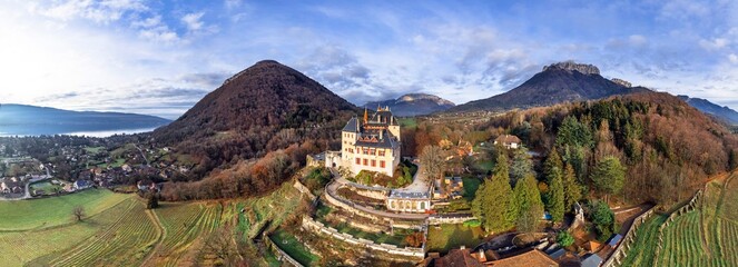 Most beautiful medieval castles of France - fairytale Menthon located near lake Annecy. aerial...