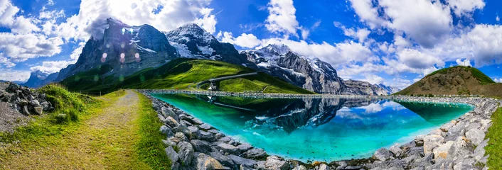 Gordijnen Switzerland nature .  panoramic view of Fallboden lake with turquoise water and reflections of snowy peaks. Kleine Scheidegg mountain pass famous for hiking in Bernese Alps. Swiss travel © Freesurf