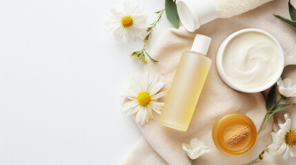 Flat lay composition with cosmetic products and chamomile flowers on white background