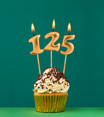 Birthday card with candle number 125 - Green background