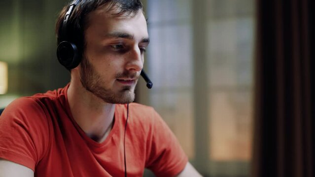 Close up of corporate operator working in customer support speaking on video call using laptop. Call center agent in wireless headset helping customer with complaints at home. Online consultation