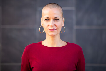 serious woman with shaved head